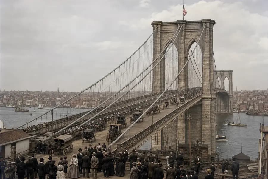 Illustrated opening-day scene at the Brooklyn Bridge with crowds and period vessels